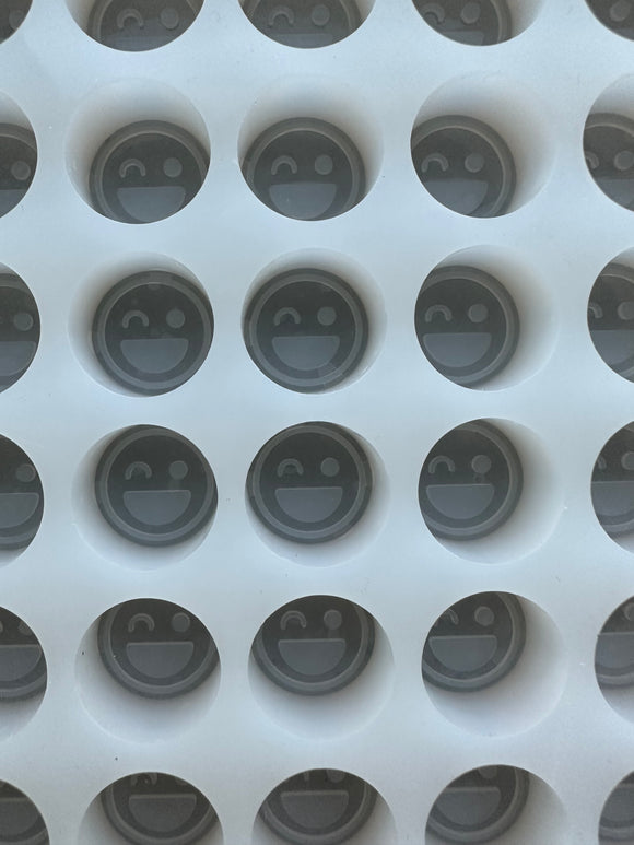 Smiley face mold close up view